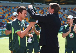 The next generation...Josh Hazelwood receives his Baggy Green from Glenn McGrath.