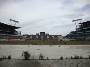 A derelict and overgrown Lancaster Park awaits demolition.