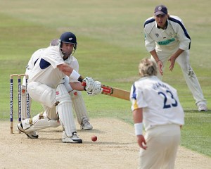 Darren Lehmann sweeps fellow countryman Shane Warne during a county match for Yorkshire. 